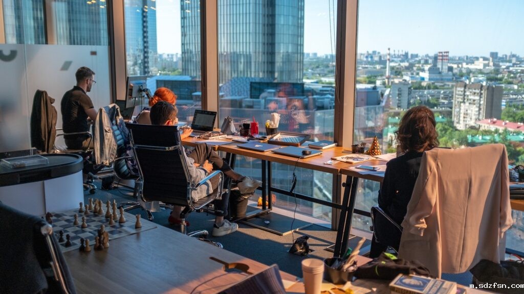colleagues-working-in-a-beautiful-office-space-looking-out-a-window-1024x576.jpg